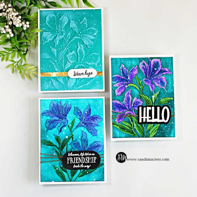Three handmade floral cards featuring Alstroemeria Blooms in vibrant teal, blue and purple, watercolored with Karin Markers and finished with white splatter and sentiments.
