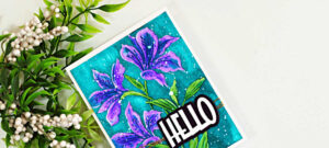 Handmade floral card featuring purple Alstroemeria blooms watercolored with Karin Markers on a vibrant teal background, finished with a bold HELLO sentiment.