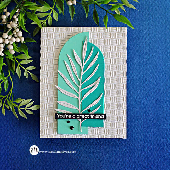 Handmade friendship card featuring overlapping teal and mint nesting arch die cuts, a white leafy branch, and a “You’re a great friend” sentiment on a textured white background.