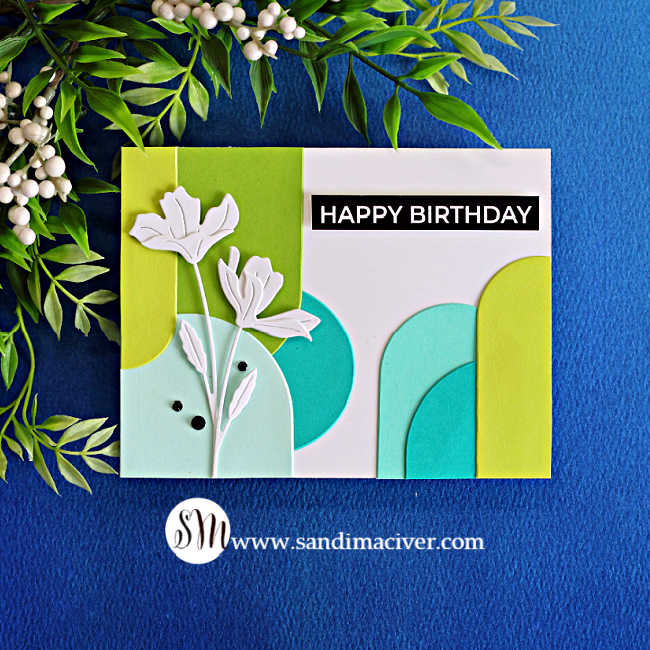 Handmade birthday card featuring colorful half-arch clusters in green, aqua and teal, accented with white Tissue Petal Stems die cuts and a black “Happy Birthday” sentiment.