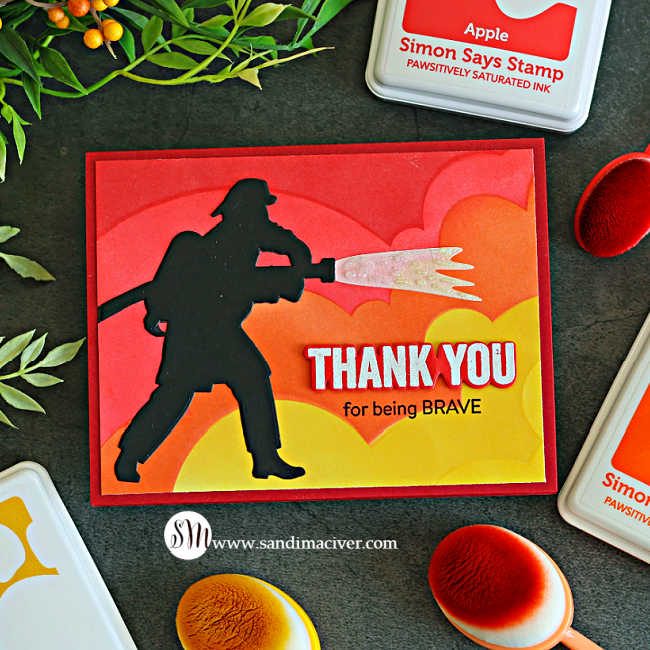 Brave Firefighter card with a black firefighter silhouette spraying sparkling water over a bold red, orange and yellow ink-blended background with a “Thank You for being Brave” sentiment.