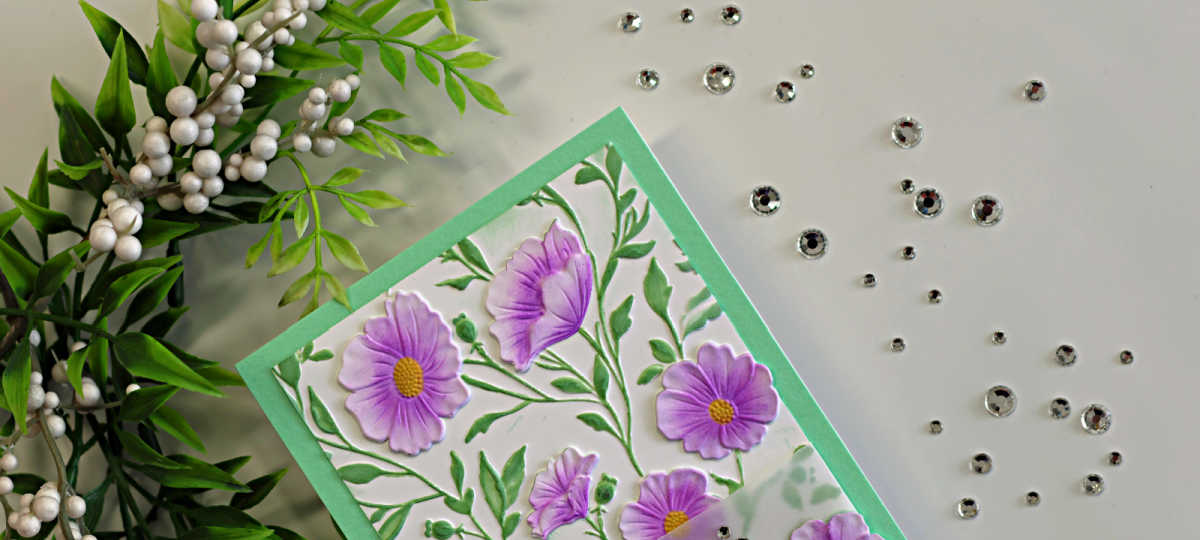 Handmade Morning Glory card featuring soft purple flowers, green foliage, and a mint green card base, created with the Simon Says Stamp Morning Glory Vibes Embossing Folder, Stencil and Die Set.