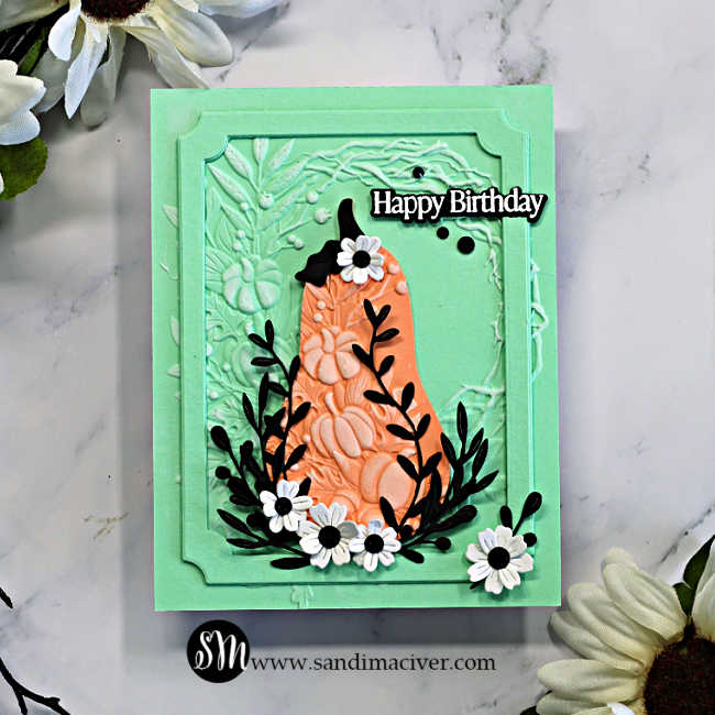 Elegant mint green and coral Harvest Heirloom card with an embossed Pumpkin Wreath background, black leafy stems, white flowers, and a Happy Birthday sentiment.