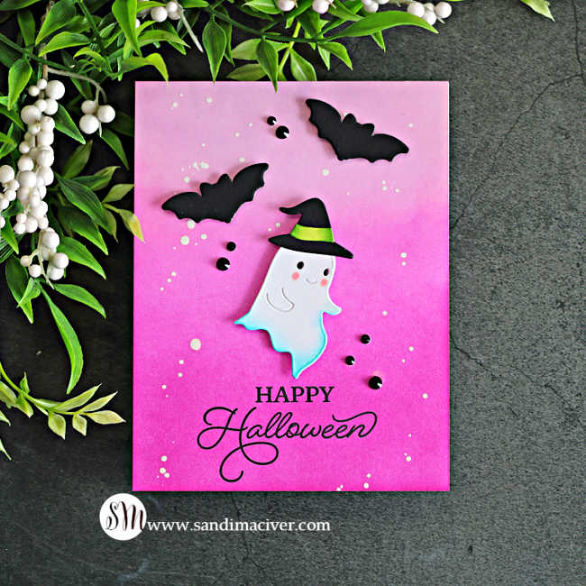 Pink Halloween card featuring a cute white ghost wearing a witch hat, black die-cut bats, and a bright pink ink-blended background with white splatters.