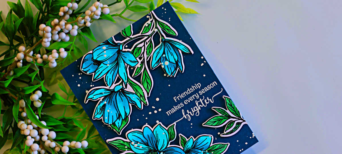 Handmade floral friendship card featuring bright turquoise flowers and green leaves on a deep teal background, created with the Gina K Designs Life’s Best Moments STAMPtember collaboration set.
