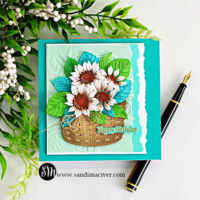 Handmade Simon Says Stamp STAMPtember® card featuring white sunflowers with brown centers, bright green and teal leaves arranged in a dimensional woven basket, with a mint embossed background, torn-edge layers and a Happy Birthday sentiment.