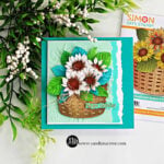 Handmade Simon Says Stamp STAMPtember® card featuring white sunflowers with brown centers, bright green and teal leaves arranged in a dimensional woven basket, with a mint embossed background, torn-edge layers and a Happy Birthday sentiment.