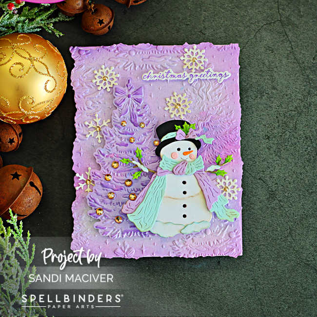 Vintage Sweet Snowman Christmas card featuring a lavender embossed background, dimensional snowman and tree, snowflakes, gold gems and a Christmas greeting.
