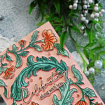Pinkfresh Studio Grace and Gratitude floral card featuring soft peach flowers, mint green foliage, and a “Celebrating along with you” sentiment.