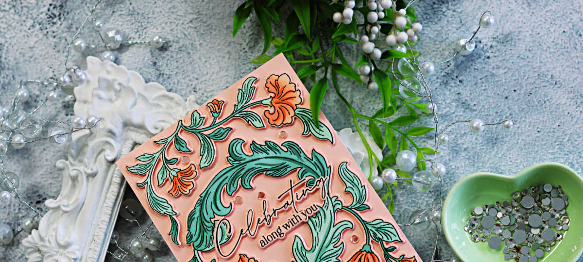 Pinkfresh Studio Grace and Gratitude floral card featuring soft peach flowers, mint green foliage, and a “Celebrating along with you” sentiment.
