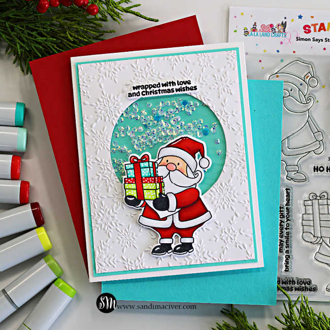 Copic-colored Santa Christmas shaker card with colorful presents, aqua shaker window, and white embossed snowflake background.