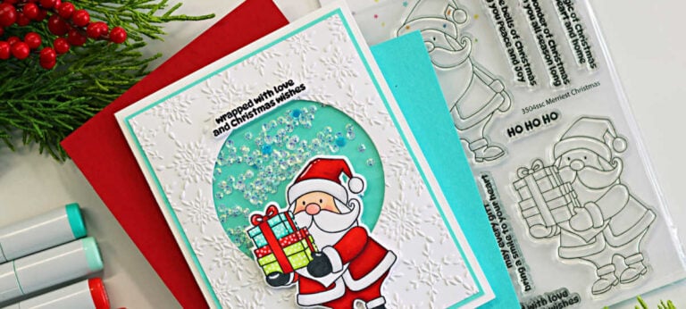 Simon Says Stamp and La-La Land Crafts Santa shaker card featuring a Copic-colored Santa, aqua shaker window, and embossed snowflake background.